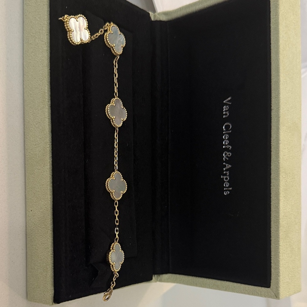 Elegant Gold Bracelet with White Clover Charms
